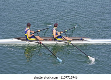 Two Young Rowers In A Racing Rower Boat
