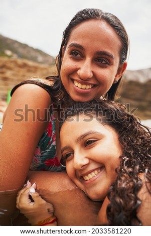 Similar – Happy women looking at camera over garden fence