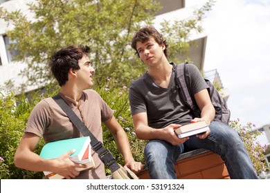 Two Young Student Talking At The School (selective Focus)