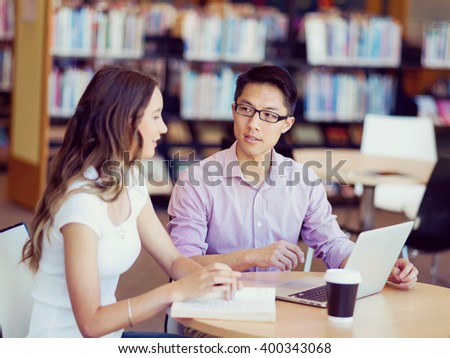 Two young students at the library