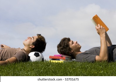 Two young students lying on the grass - Powered by Shutterstock