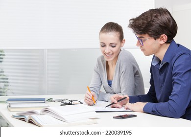 Two Young Students Working Together