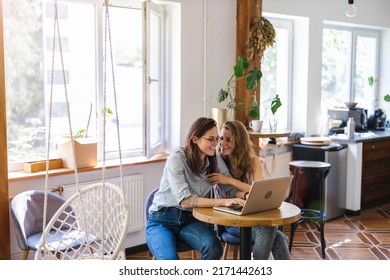 Two Young Woman Using Laptop At Home
