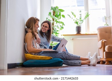 Two Young Woman Using Laptop At Home
