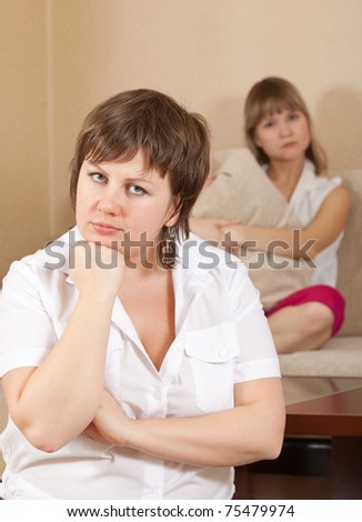 Two young women after conflict  at home