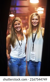 Two young women with backstage passes at a concert. This concert was created for the sole purpose of this photo shoot, featuring 300 models and 3 live bands. All people in this shoot are model