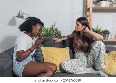 Two Young Women College Roommates Or Coworkers Argue About Rent And Expenses For The Apartment 