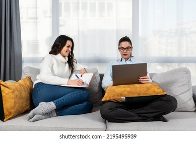 Two Young Women Couple Making Their Online Business For Shopping Booking And Restaurant Reservation As Internet App Service. Lesbian Girls Working On Plans And Ideas For Their New Small Company.