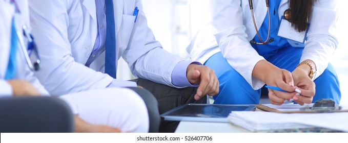Two young women doctors sitting on the sofa - Shutterstock ID 526407706