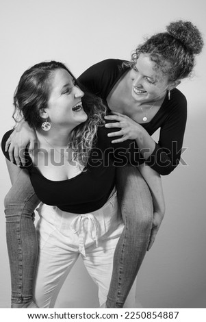 Image, Stock Photo Studio portrait of a young couple hugging