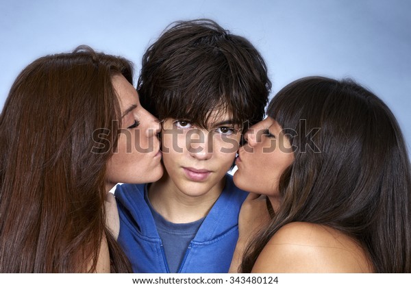 Young women kissing