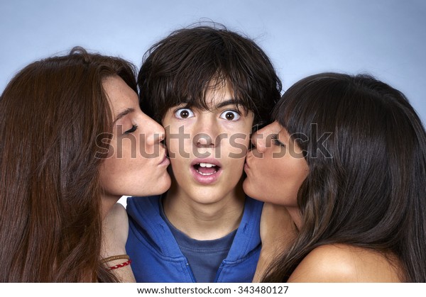 Young women kissing