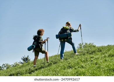 Two young women, a lesbian couple, hike through a scenic wilderness, enjoying the outdoors together. - Powered by Shutterstock