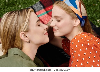 Two young women, a lesbian couple, embrace intimately in a lush green park. - Powered by Shutterstock