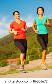 Two Young Women Running Outdoor
