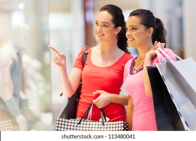 Two Young Women Shopping In Mall