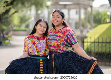 Two young women show their beautiful typical dress from Quetzaltenango Guatemala.