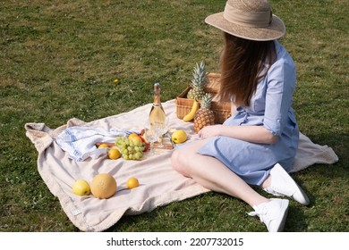 A Two Young Women In A Similar Blue Dress Is Resting On A Picnic, Chees Plate