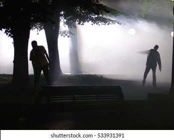 Two Zombies In Forest At Night, Silhouettes, Halloween Concept