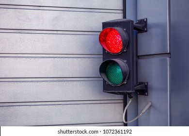 Two-color small traffic light. Red and green colors. Red light is on - Shutterstock ID 1072361192
