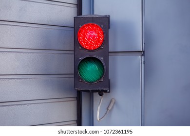 Two-color small traffic light. Red and green colors. Red light is on - Shutterstock ID 1072361195