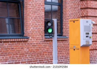 Two-color traffic light and a device for accepting tickets in a paid parking lot.