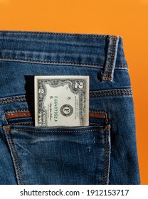 Two-Dollar Bill, Rare 2 American Dollar Bill In Denim Trouser Pocket. Two Us Dollar Note, Paper Money, Top View, Isolated, Orange Background, Vertical