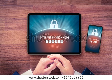 Two-factor authentication (2FA) and verification security concept. User with digital tablet and smart phone and two-factor authentication security process. Verify code on smart phone, flatlay design.