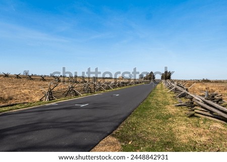 A two-lane road in the Gettysburg National Military Park in Gettysburg, Pennsylvania, USA on a sunny winter day