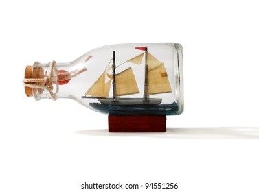 Two-masted Ship In A Bottle Isolated On White Background