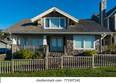 Two-story Beach House With Gray Weathered Shingle Siding