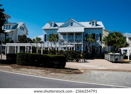 Two-story houses with white pergola, metal roof and curb appeal along scenic 30A country road in Santa Rosa, South Walton near Destin, Florida Panhandle. Residential vacation homes clear blue sky Stock photo © 