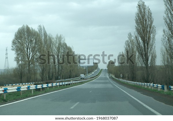 two-way highway\
in the evening under the\
clouds