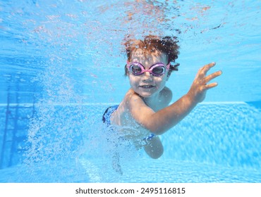 two-year-old boy himself swims in the pool underwater - Powered by Shutterstock