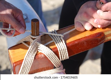 Tying The Iako Of The Polynesian Canoe.