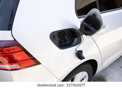 type 2 CCS plug port on electric vehicle. Fast charging socket type 2 combo electric car. DC - CCS type 2 EV charging connector at EV car. Eco friendly alternative energy green environment concept - Shutterstock ID 2177619277