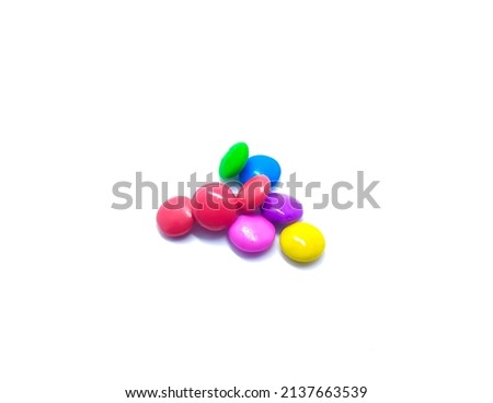 A type of coloured smaller sweets(gems) with white background.