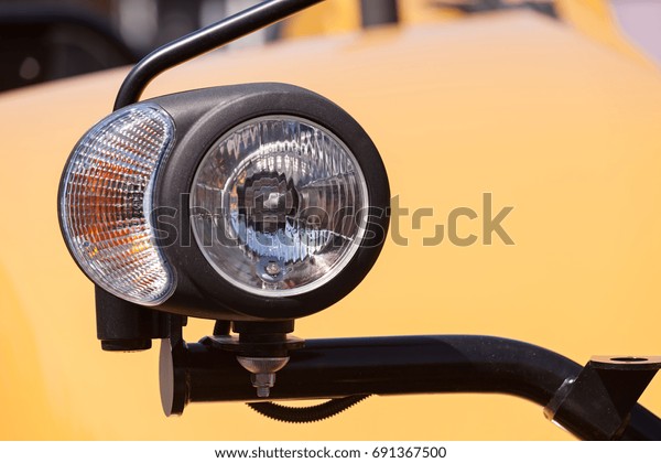 type headlights of the machine, note shallow depth\
of field