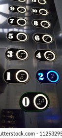 An elevator  is a type of vertical transportation that moves people or goods between floors of a building, vessel, or other structure. 