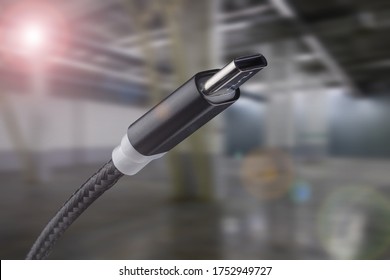 Type-C USB cable on an industrial background.