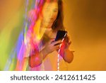 Types a text message. Texting and chatting on messengers close up on a neon glowing background
