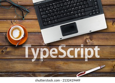 TypeScript Programming Language. Word TypeScript on wooden desk and laptop 