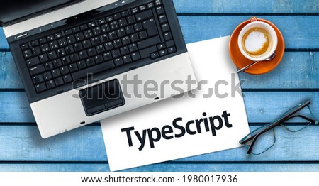 TypeScript Programming Language. Word TypeScript on paper and laptop