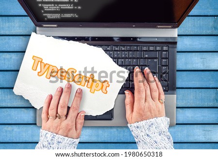 TypeScript Programming Language. Word TypeScript on paper and laptop 