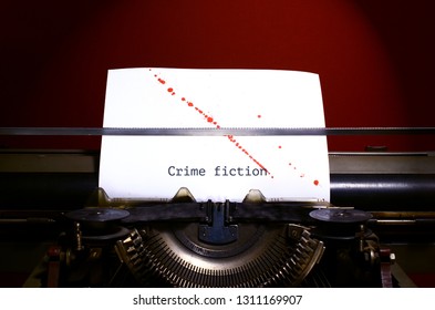 Typewriter Spelling Crime Fiction On Paper With Blood Splashes