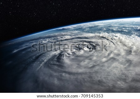 Typhoon over planet Earth - satellite photo. Elements of this image furnished by NASA.