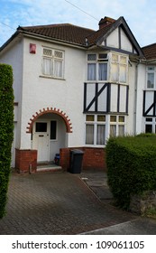 Typical 1930s White Detached House With Bay Window And Pretty Garden, In Bristol, England