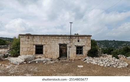 A typical abandoned rustic house made of limestone rocks in the Eastern Mediterranean region in Turkey