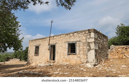 A typical abandoned rustic house made of limestone rocks in the Eastern Mediterranean region in Turkey