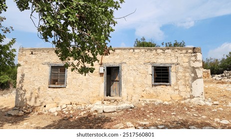 A typical abandoned rustic house made of limestone rocks in the Eastern Mediterranean region in Turkey
